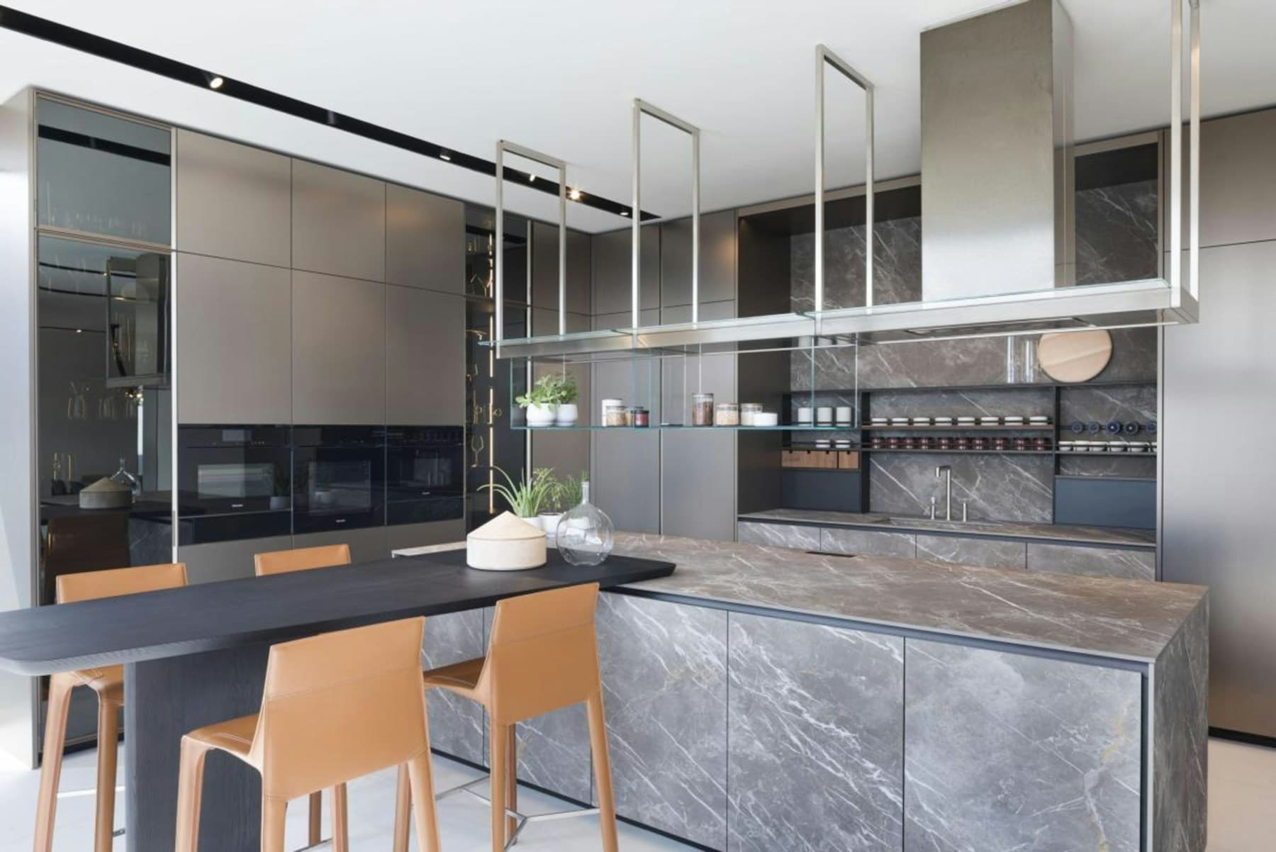 Modern kitchen wrapped in expressive gray stone